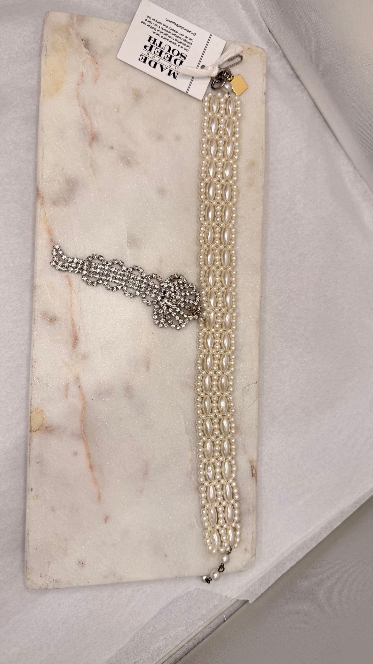 Made white bead necklace