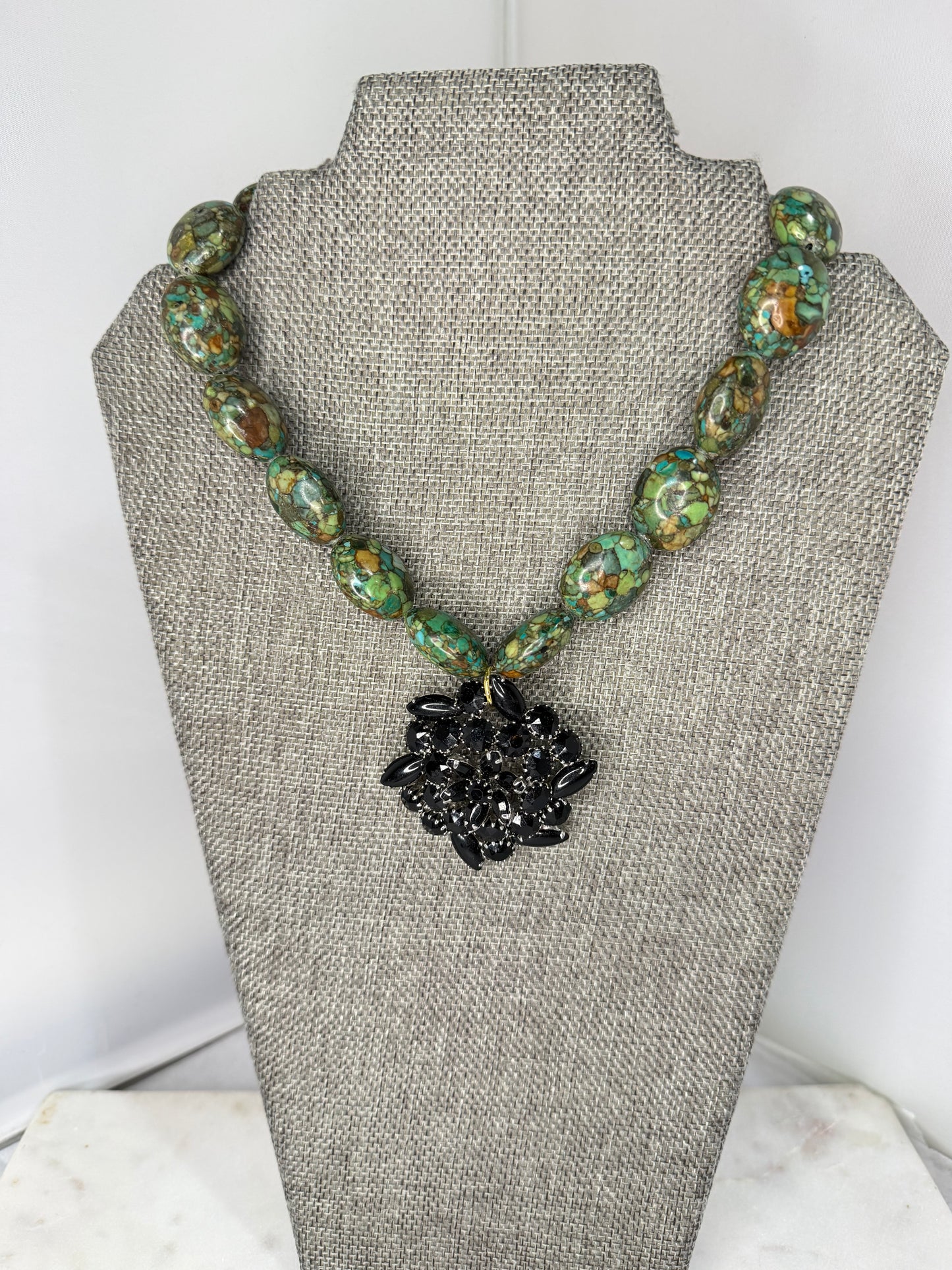 MADE black brooch green necklace